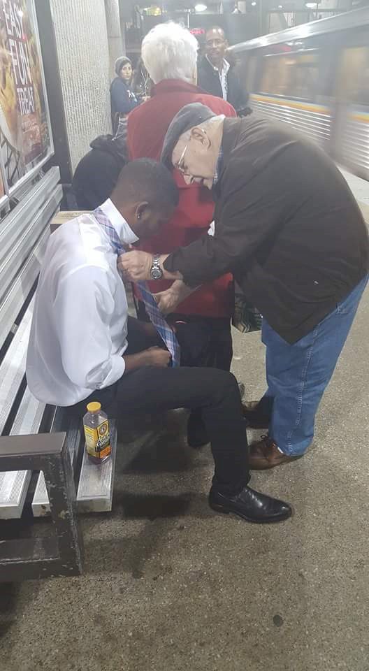 old man helps boy at subway 2