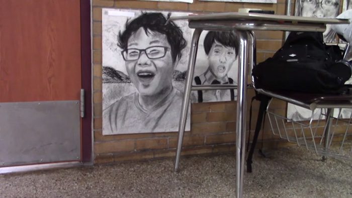 student draws classmates