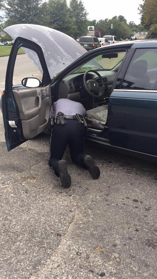 officer helping motorist